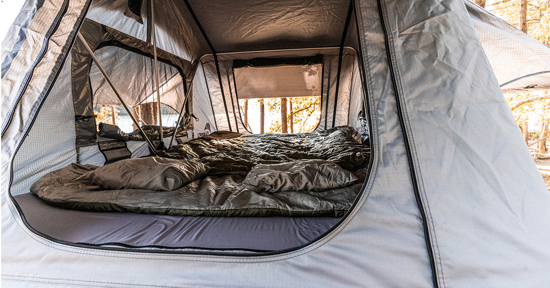 Backcountry Sportsman Napier rooftop tent set up on a vehicle, showing its durable fabric and spacious interior for camping adventures.