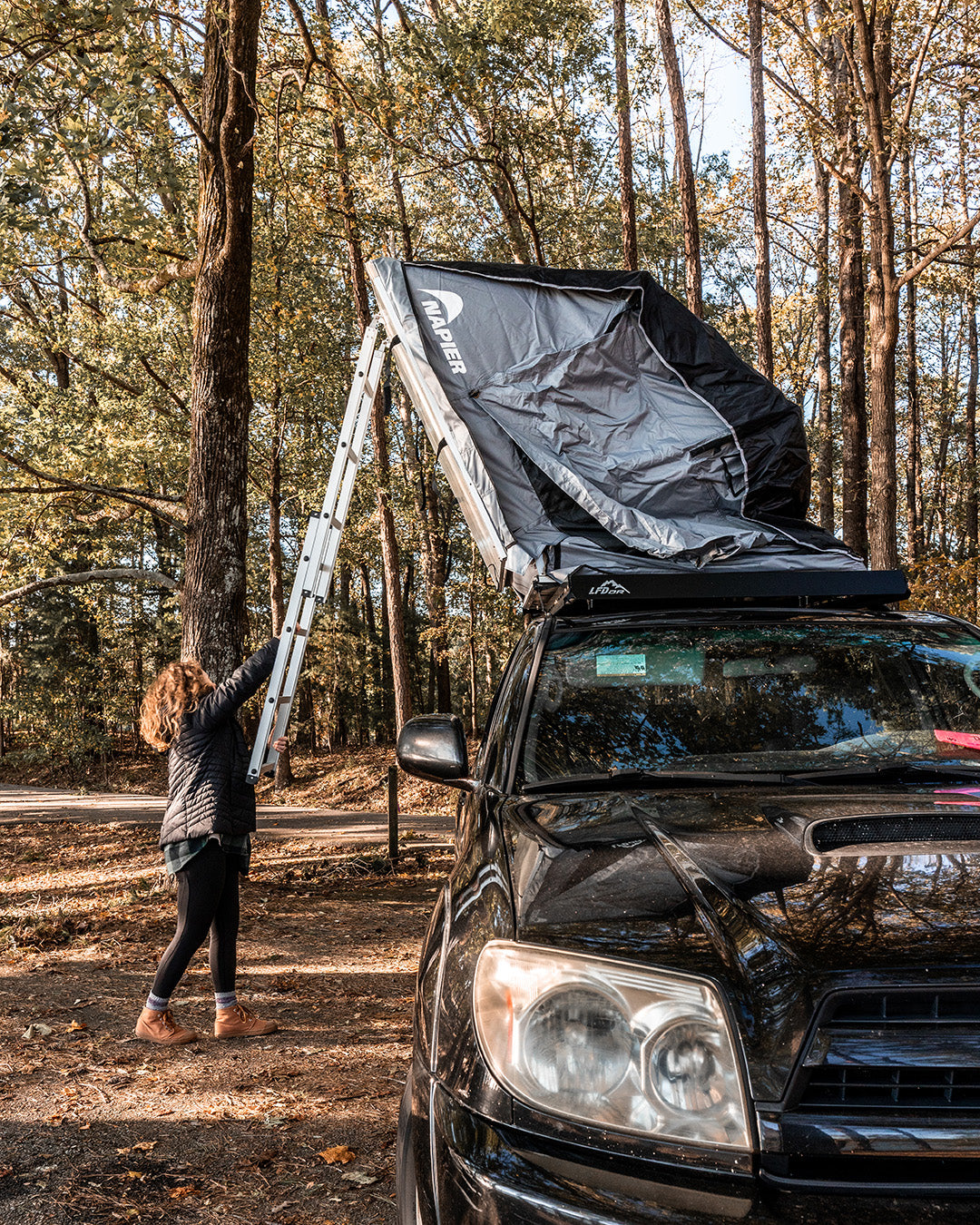 Backcountry Sportsman Napier rooftop tent set up on a vehicle in a scenic outdoor location, showcasing its spacious design.