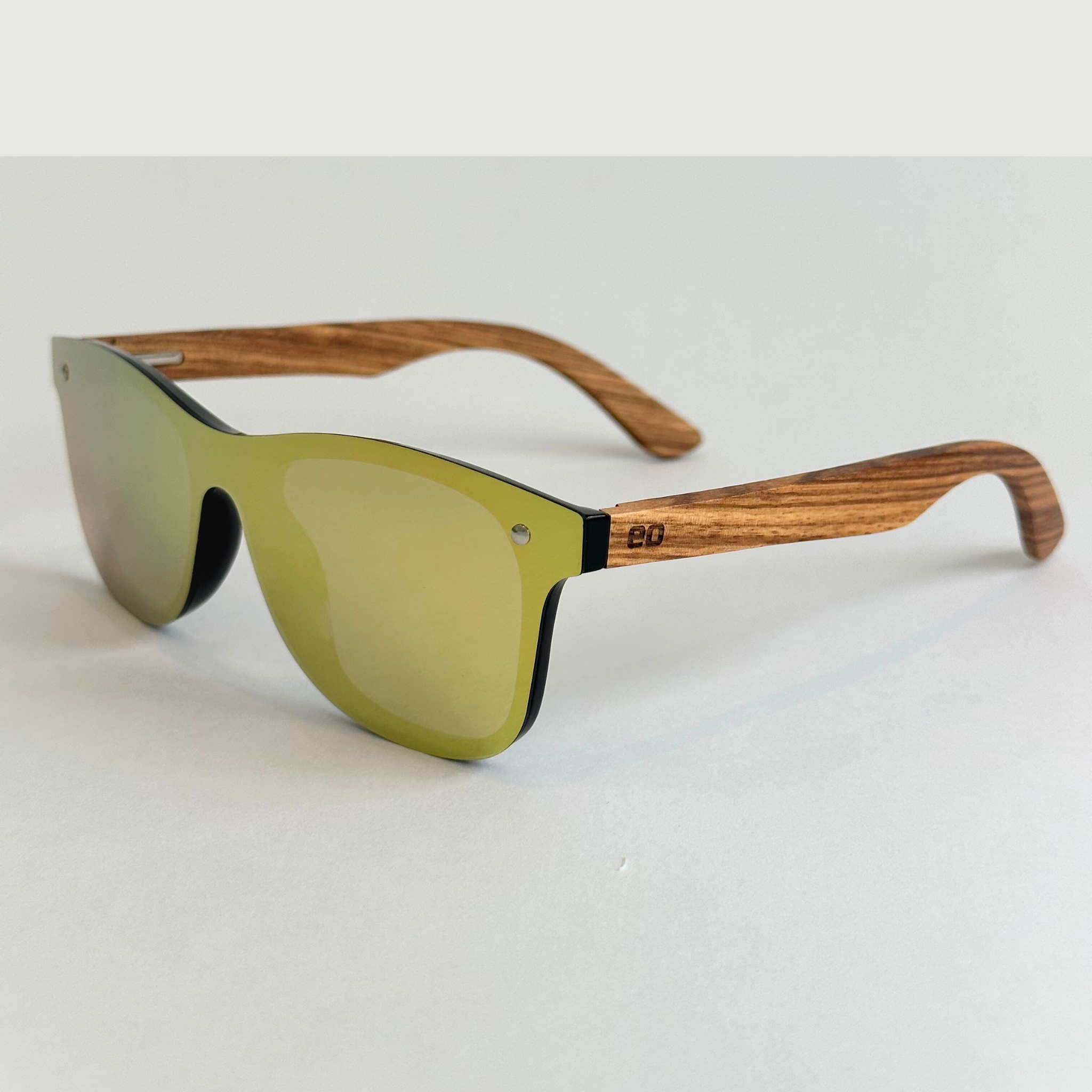 Eastern Outer Natalia sunglasses in zebrawood with rounded frames, shown from a left angle, showcasing their stylish design.