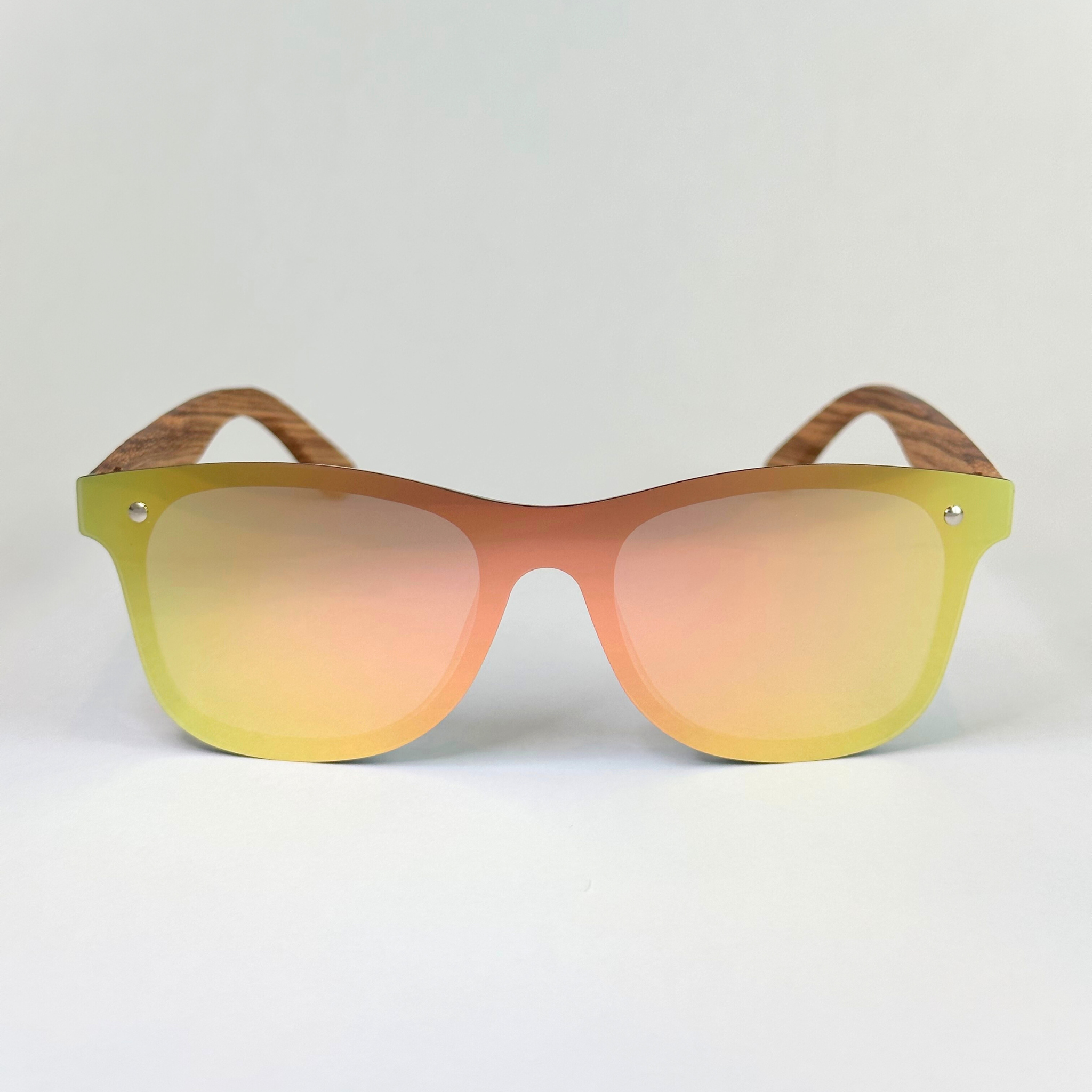 Eastern Outer Natalia sunglasses with zebrawood frames and dark tinted lenses, stylish and durable eyewear.