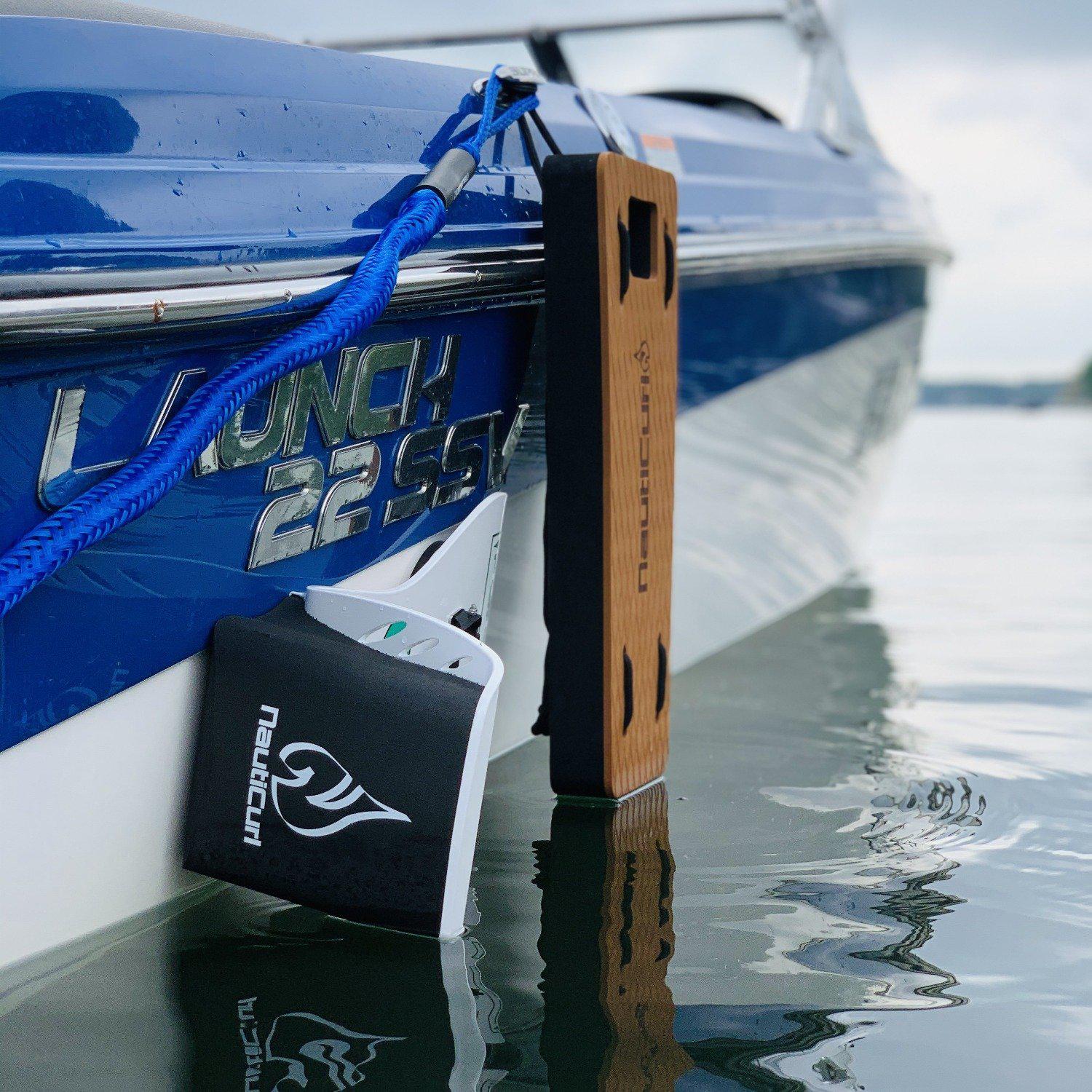 NautiFender flat teak boat fender from NautiCurl LLC, showing a durable, rectangular fender designed to protect boat sides.