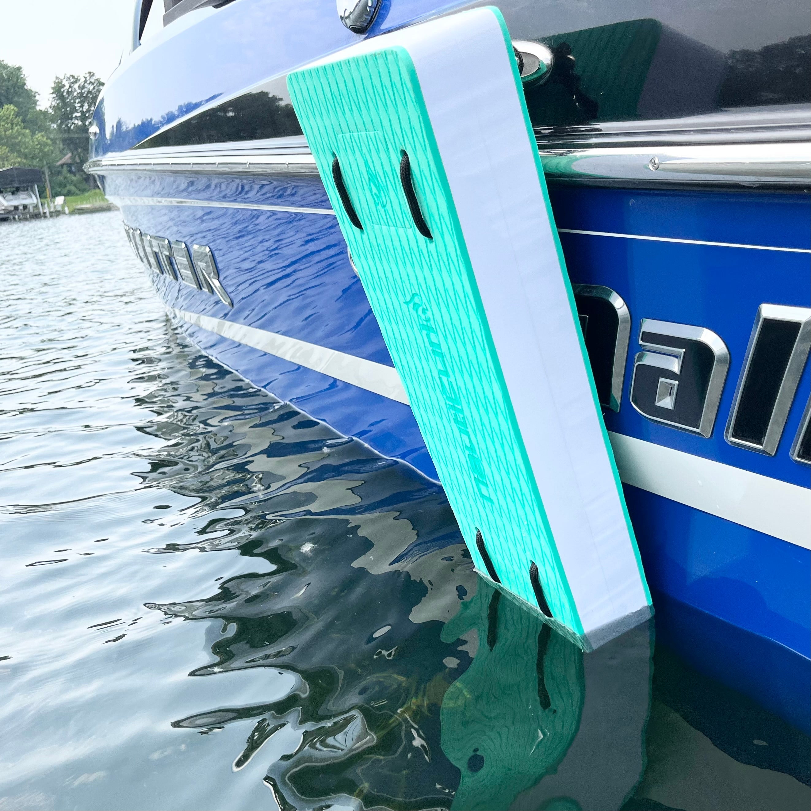 Colorful NautiFender flat boat fender by NautiCurl LLC, showing its durable, inflatable design for protecting boat hulls.