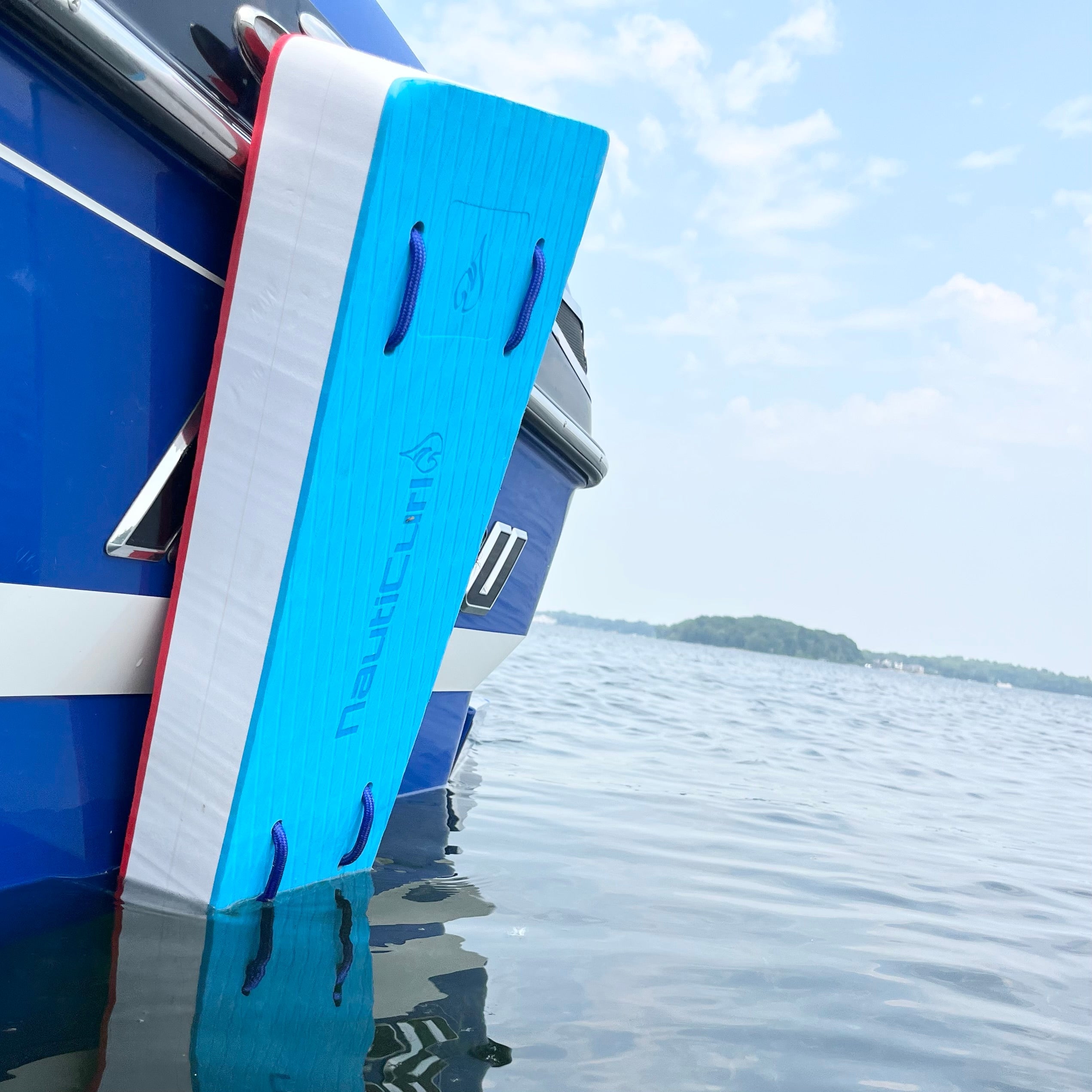 Colorful NautiFender flat boat fender by NautiCurl LLC, showing a close-up of the durable, inflatable boat bumper in vibrant colors.