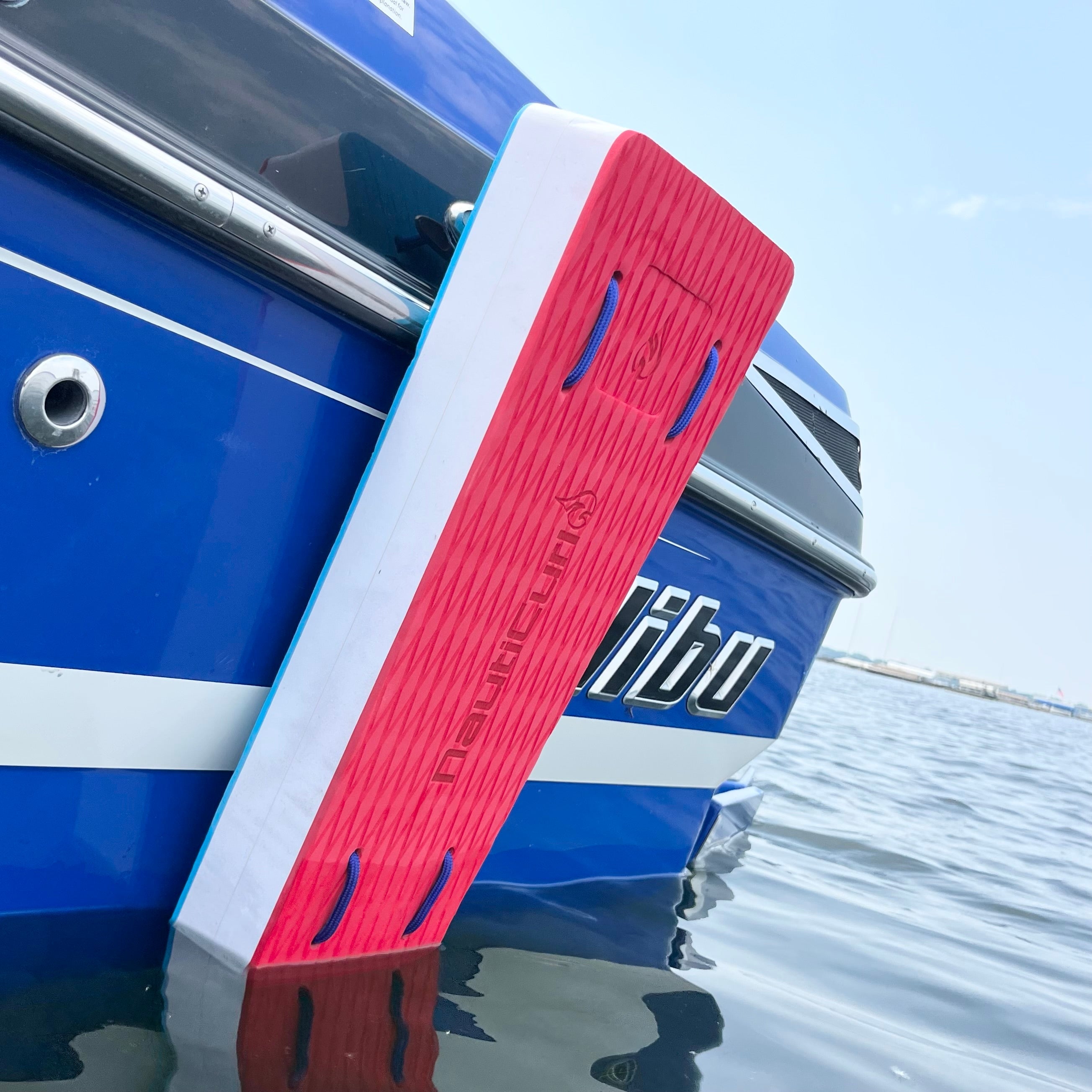 NautiFender flat boat fender by NautiCurl LLC, showing a durable, rectangular boat bumper with bright yellow and black colors.