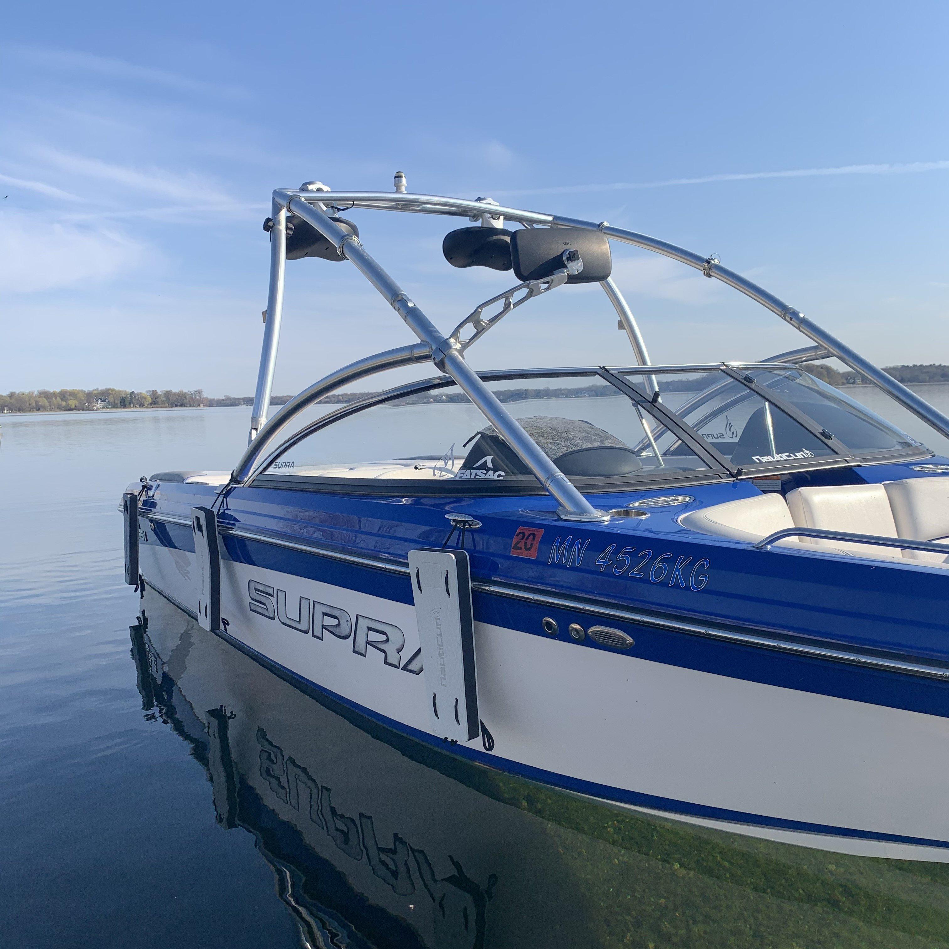 NautiFender flat boat fender by NautiCurl LLC, showing a durable, rectangular boat bumper with a rope for marine protection.