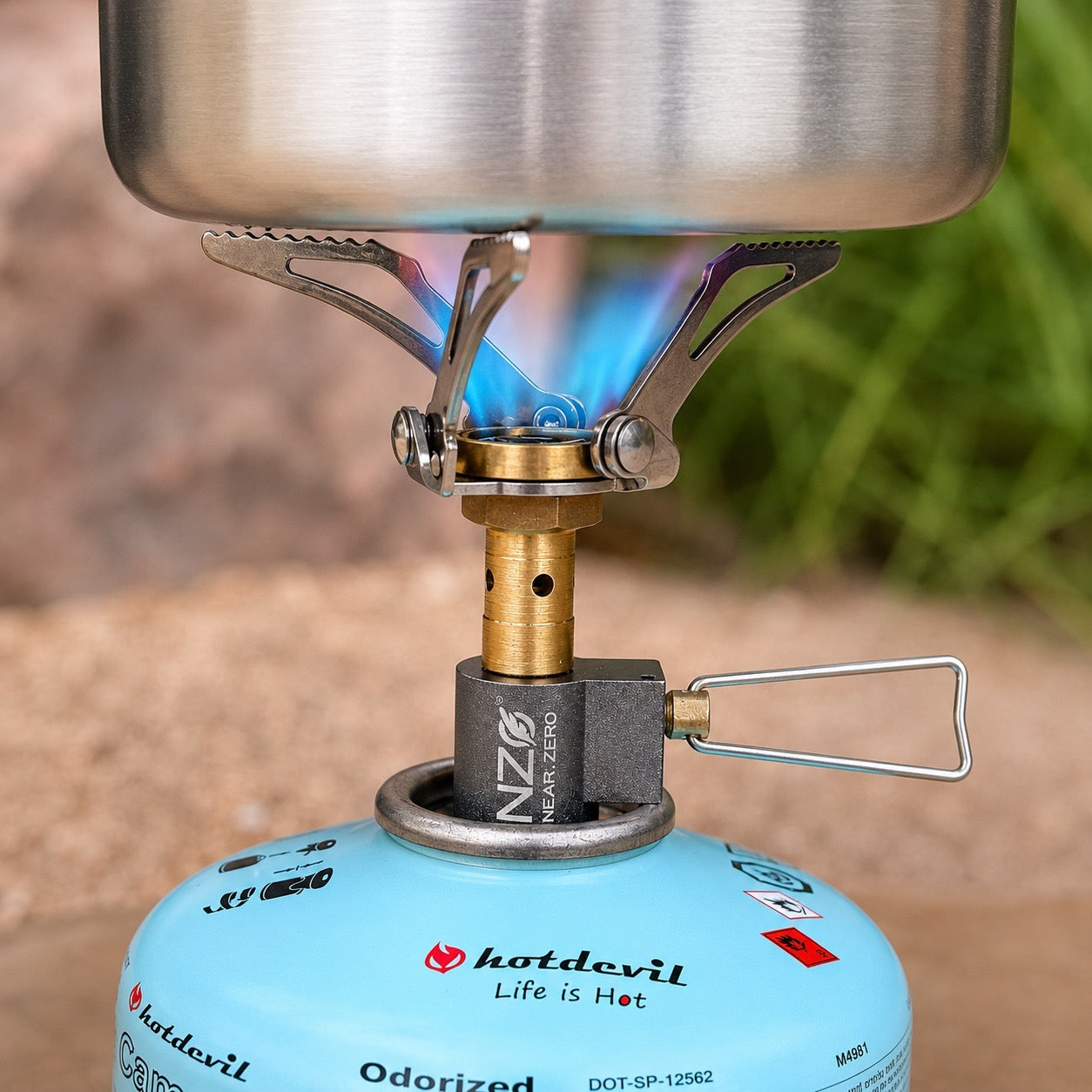 Near Zero Outdoor Gear Mini Stove mounted on a canister, showcasing compact outdoor cooking accessories for camping and hiking.