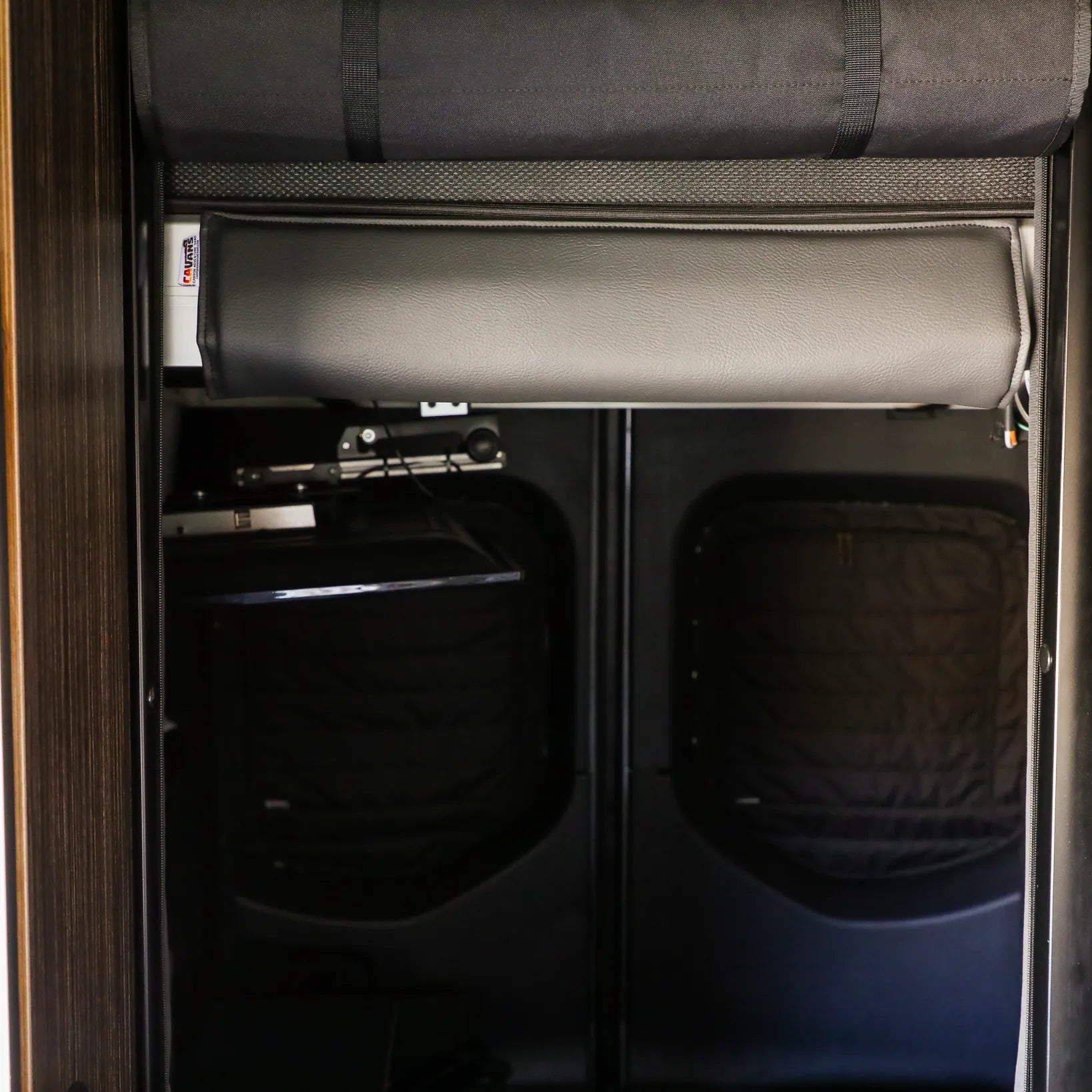 Canyon Adventure Vans CAV branded bed head bumper for 2019+ REVEL vehicles, shown in black with protective padding.