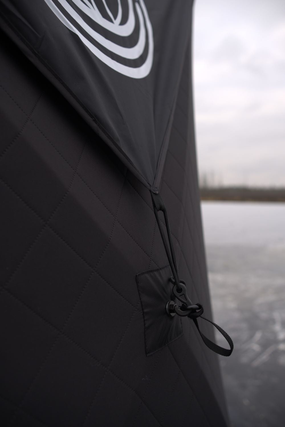 North Shore Sauna Nova 6 Sauna Tent Rain Cover attached to the sauna, showing durable waterproof material and attachment points.
