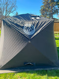 North Shore Sauna Nova 6 sauna tent rain cover with chimney hole for outdoor heat therapy and weather protection.