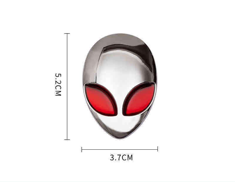 Alien metal emblem by Bean's Moto Booth featuring a detailed extraterrestrial design on a metallic surface.