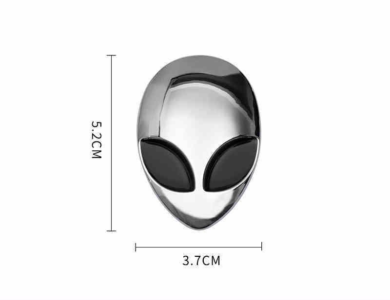 Alien metal emblem by Bean's Moto Booth featuring a sleek, detailed alien design on a metallic surface.