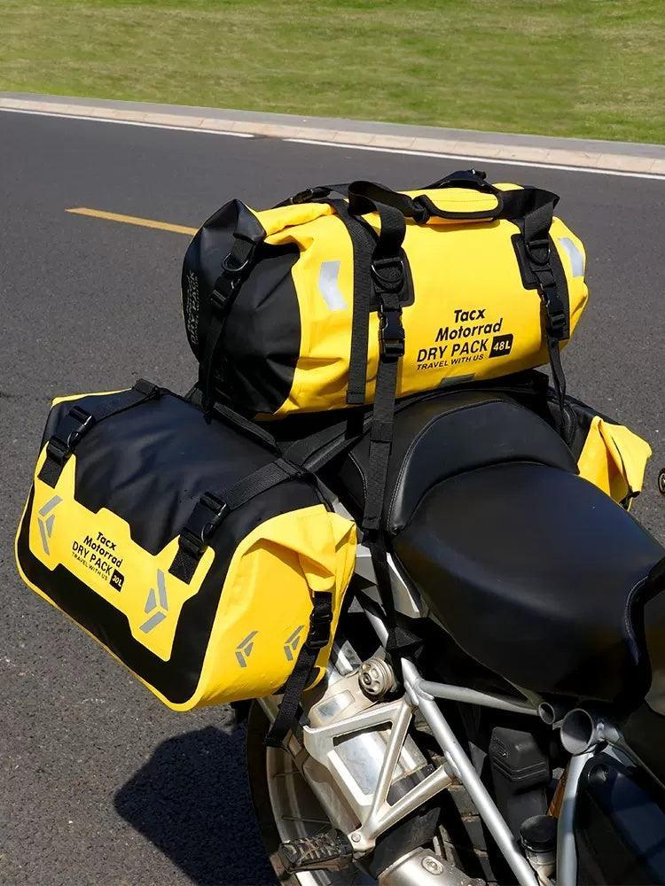 Bean's Moto Booth TACX™ 2-in-1 waterproof motorcycle saddlebag and pannier bag, shown attached to motorcycle for storage.