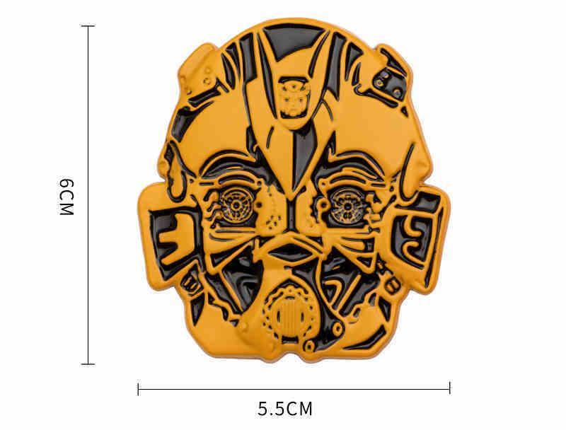 Metal emblem featuring Transformers design from Bean's Moto Booth, with detailed metallic finish and intricate robot graphics.
