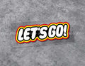 Colorful LET'S GO! sticker decor by Bean's Moto Booth featuring bold text and playful design for decorating surfaces.