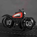 Vintage motorcycle-themed flip clock by Bean's Moto Booth showing a retro style clock with motorcycle graphics and flip date display.