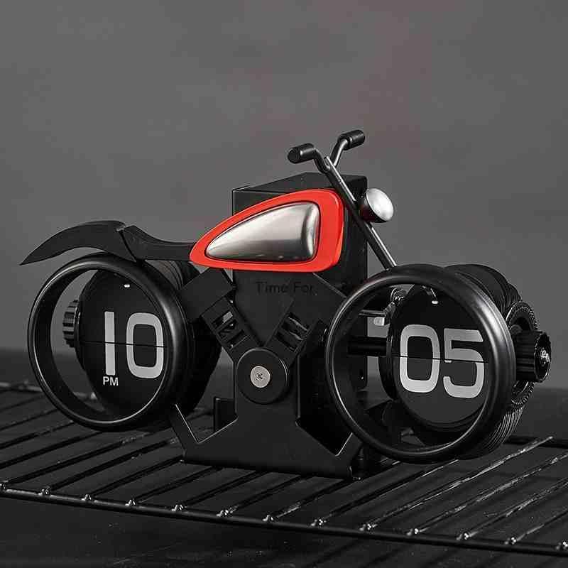 Vintage motorcycle-themed flip clock by Bean's Moto Booth showing a retro style clock with motorcycle graphics and flip date display.