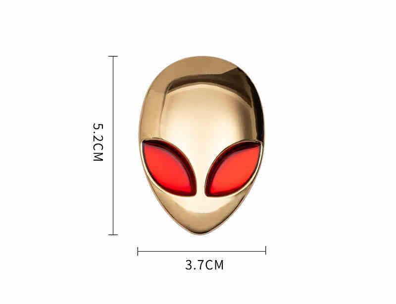 Alien metal emblem by Bean's Moto Booth, featuring a detailed alien head design on a metallic surface.