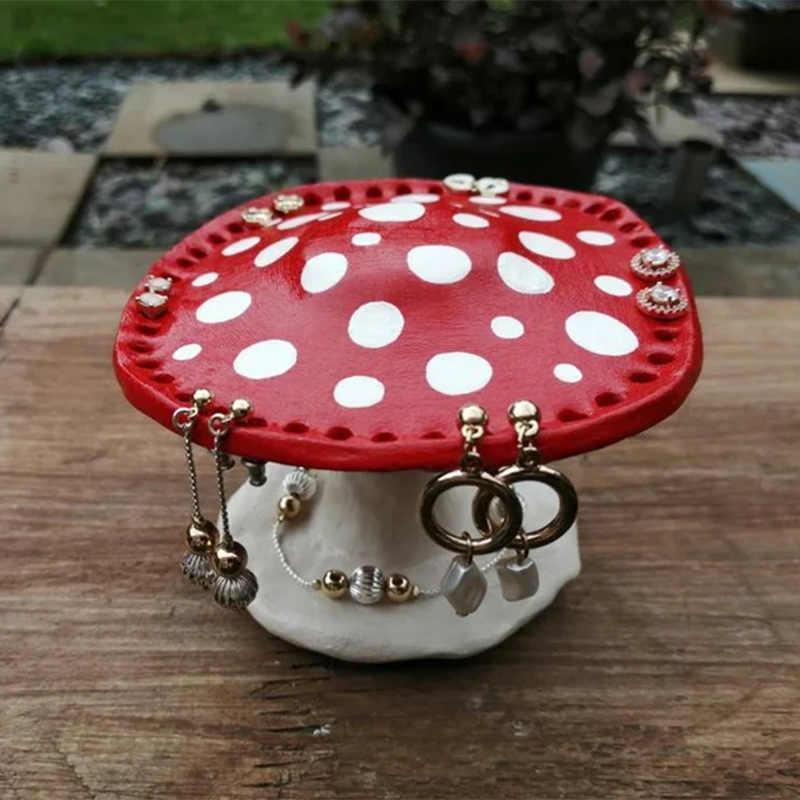 Bean's Moto Booth mushroom earring stands, black ceramic with textured mushroom design, perfect for displaying jewelry.