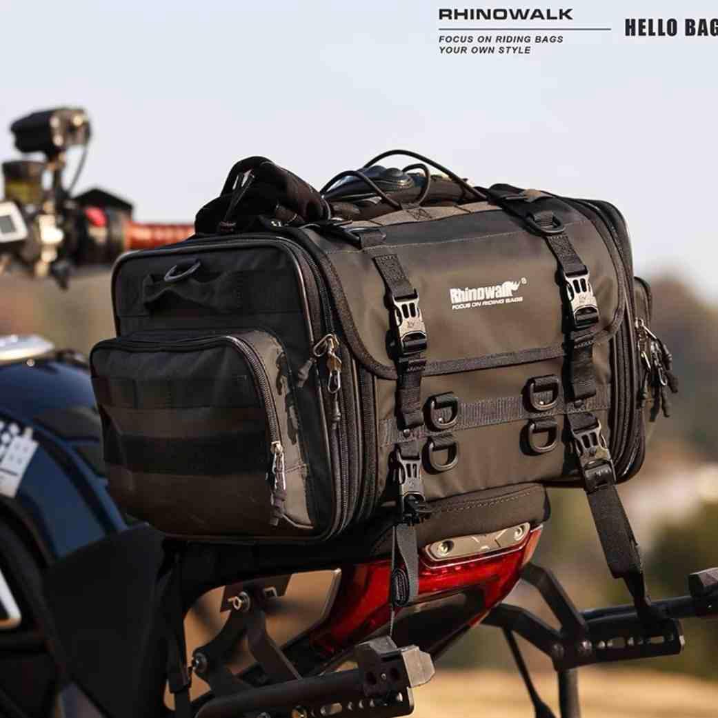 Rhinowalk™ motorcycle touring tail bag on a motorcycle, black durable motorcycle bag with straps and storage compartments.