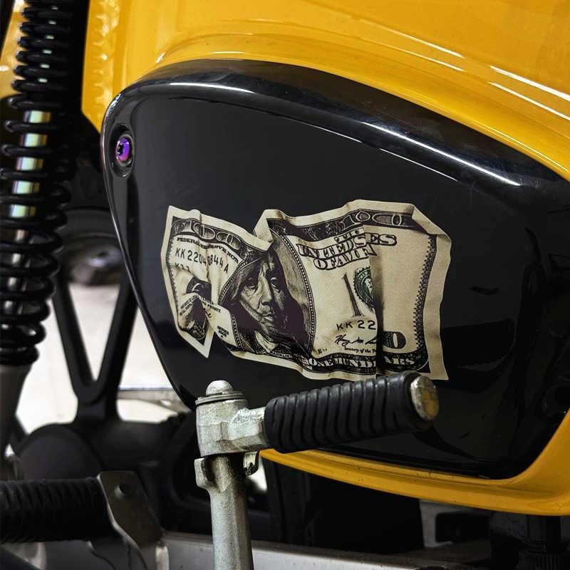 Funny wrinkled dollar sticker used as decor, featuring a humorous design by Bean's Moto Booth in vibrant colors.