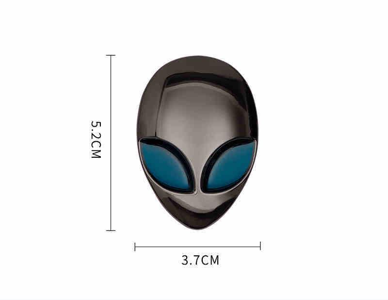 Alien metal emblem by Bean's Moto Booth, featuring a detailed alien head design on a metallic surface.