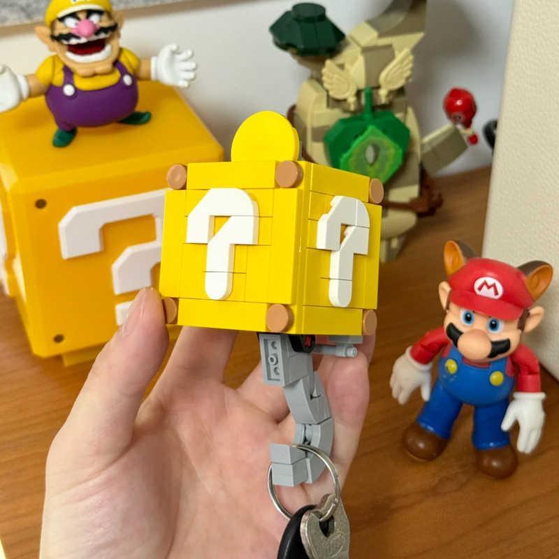 Super Mario-themed motion key hook decor by Bean's Moto Booth featuring a colorful Mario character design.