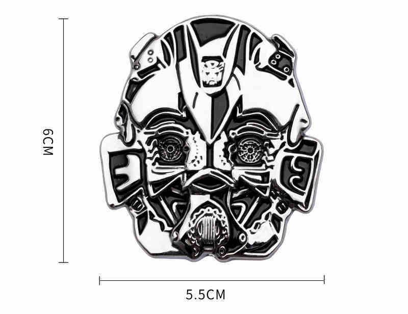 Transformers metal emblem with detailed robot design, made by Bean's Moto Booth, showcasing a sleek metallic finish.