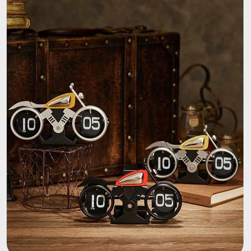 Vintage motorcycle-themed flip clock by Bean's Moto Booth showing a retro design with motorcycle illustrations and flipping time display.