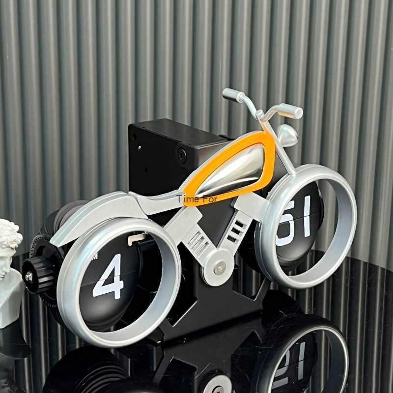 Vintage motorcycle-themed flip clock by Bean's Moto Booth showing a retro design with motorcycle graphics and flipping time display.