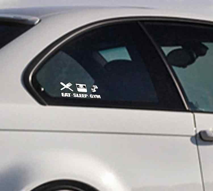 Decor sticker featuring the phrase "EAT! SLEEP! GYM!" by Bean's Moto Booth, with bold black text on a white background.