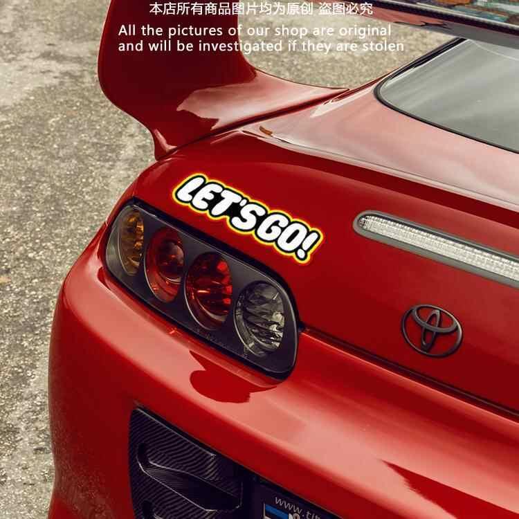 Colorful LET'S GO! sticker decor from Bean's Moto Booth, featuring bold text design for decorating surfaces.