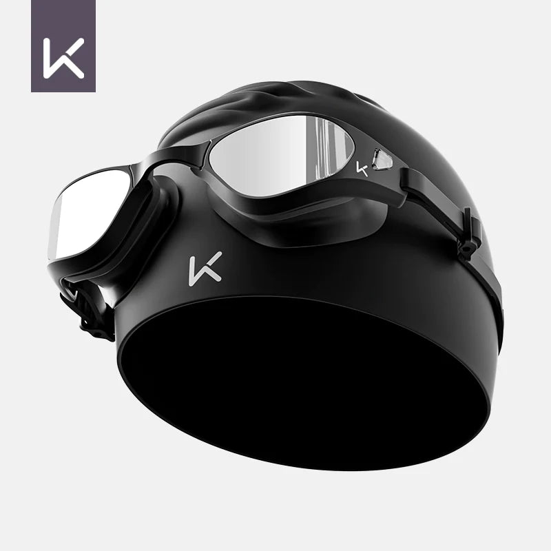 Hendrix Arts waterproof swim goggles with anti-fog HD lenses, suitable for myopia, worn with a swim cap for male and female swimmers.