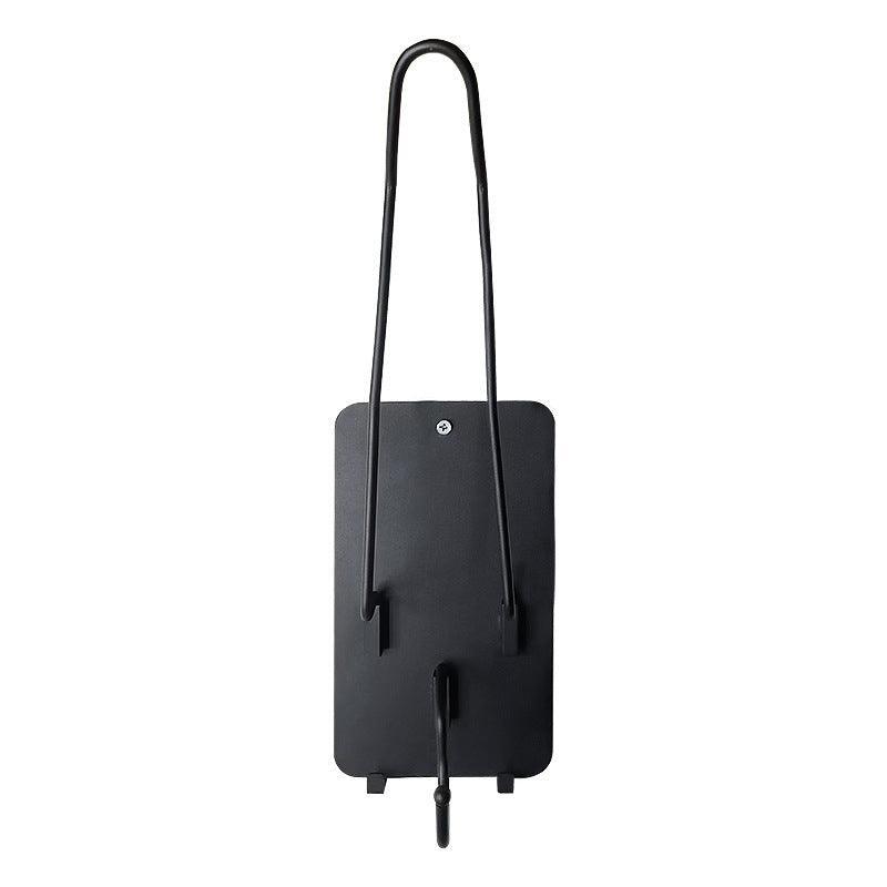 Bean's Moto Booth motorcycle helmet stand holding a black helmet on a white background for easy storage and display.