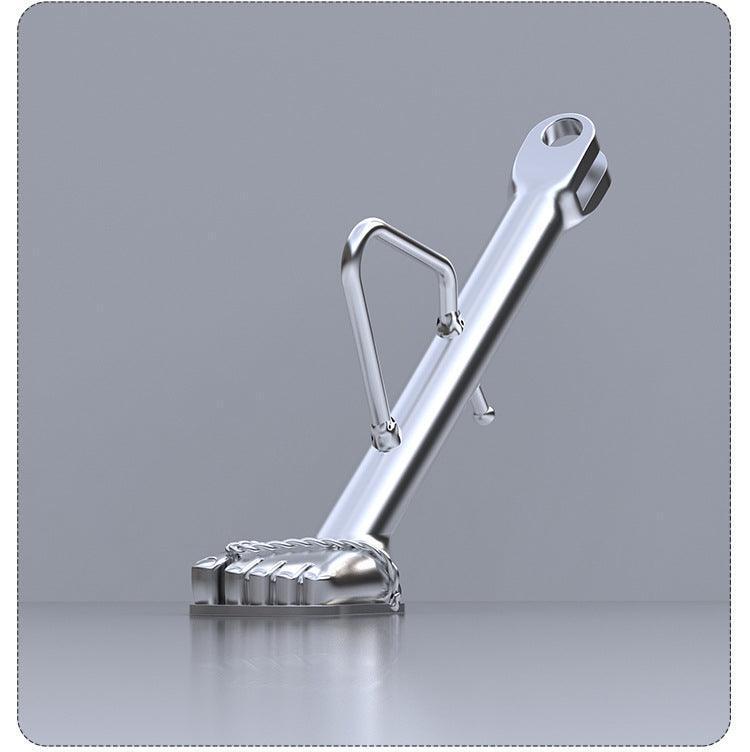 Stainless steel flip-flop motorcycle kickstand for bikes, designed by Bean's Moto Booth, shown in a close-up view.