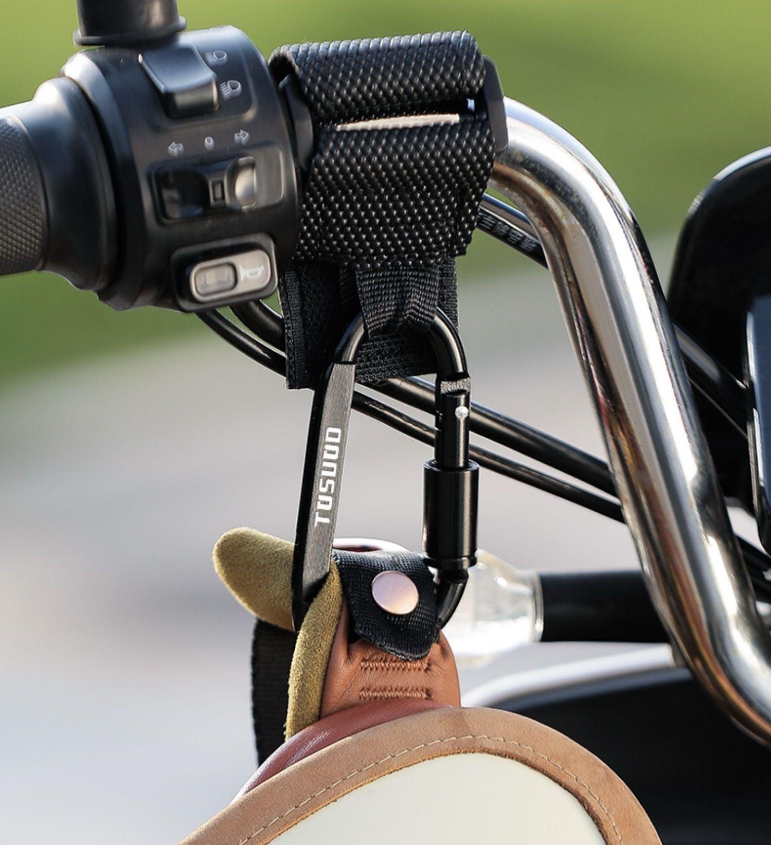 Aluminum alloy Velcro hook for motorcycle accessories by Bean's Moto Booth, mounted on a motorcycle part.