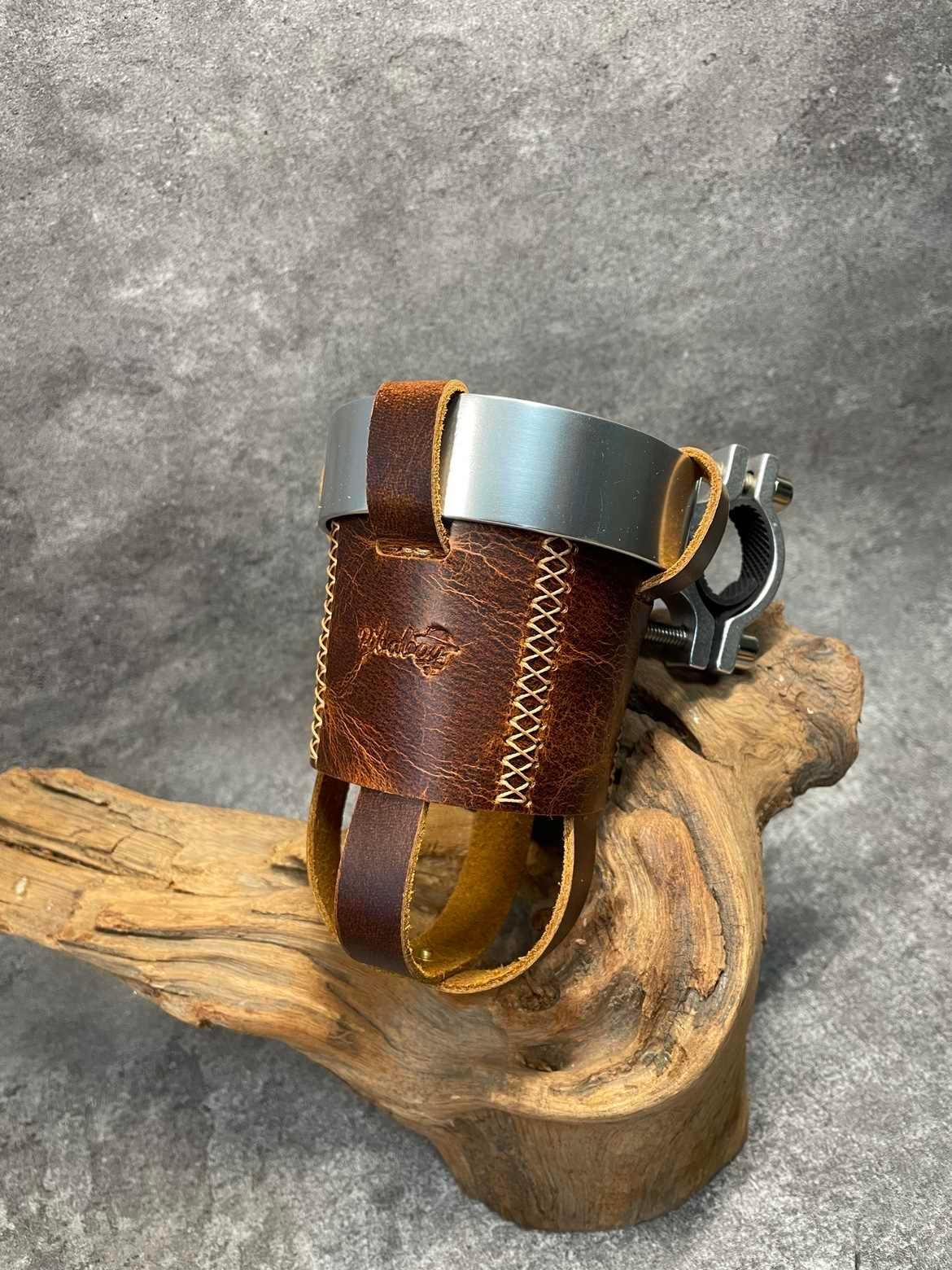 Handmade leather motorcycle water bottle holder from Bean's Moto Booth, designed as a durable motorcycle accessory.