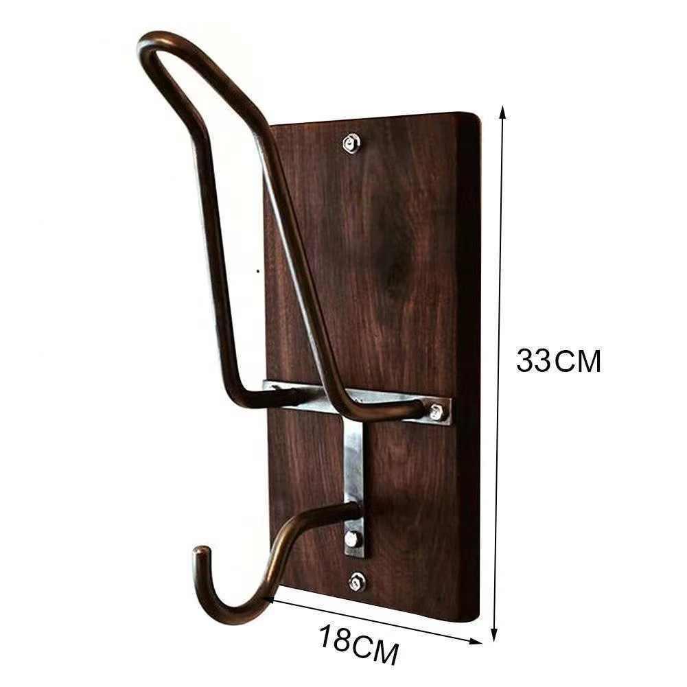 Bean's Moto Booth motorcycle helmet stand holding a black helmet, showcasing durable design and secure storage for motorcycle gear.