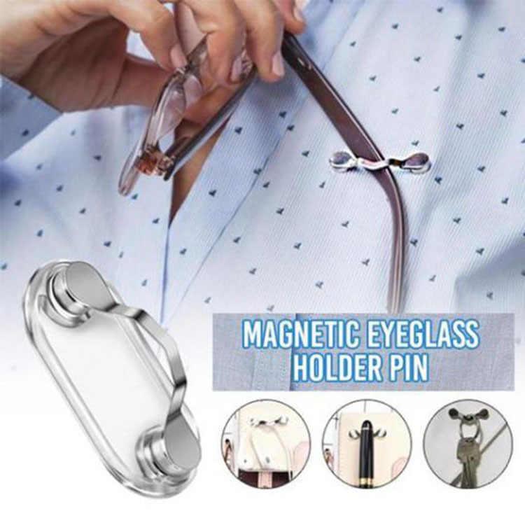 Magnetic eyeglass holder from Bean's Moto Booth showing a sleek black design attached to a car dashboard.