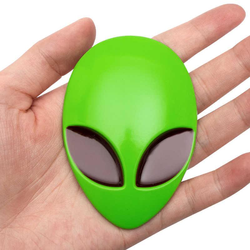 Alien metal emblem by Bean's Moto Booth featuring a detailed alien head design on a shiny metal surface.