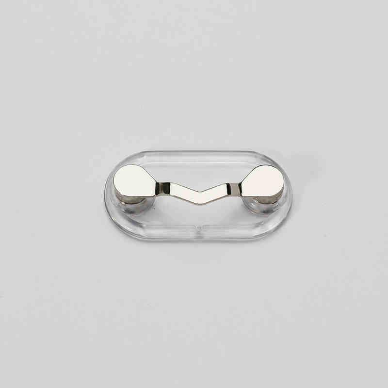 Magnetic eyeglass holder from Bean's Moto Booth, featuring a sleek design to securely hold glasses on a table or desk.