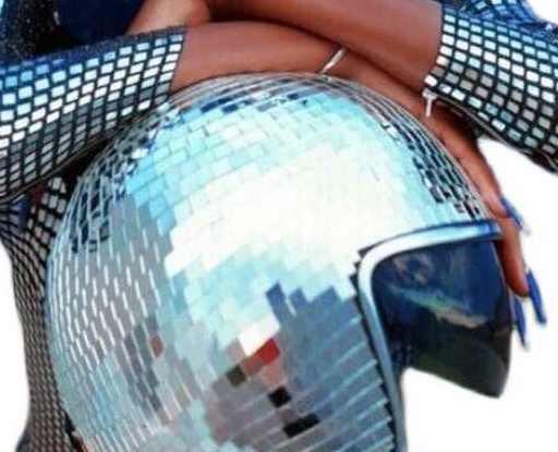 Decorative disco ball helmet by Bean's Moto Booth with shiny, mirrored surface, perfect for retro or party-themed decor.