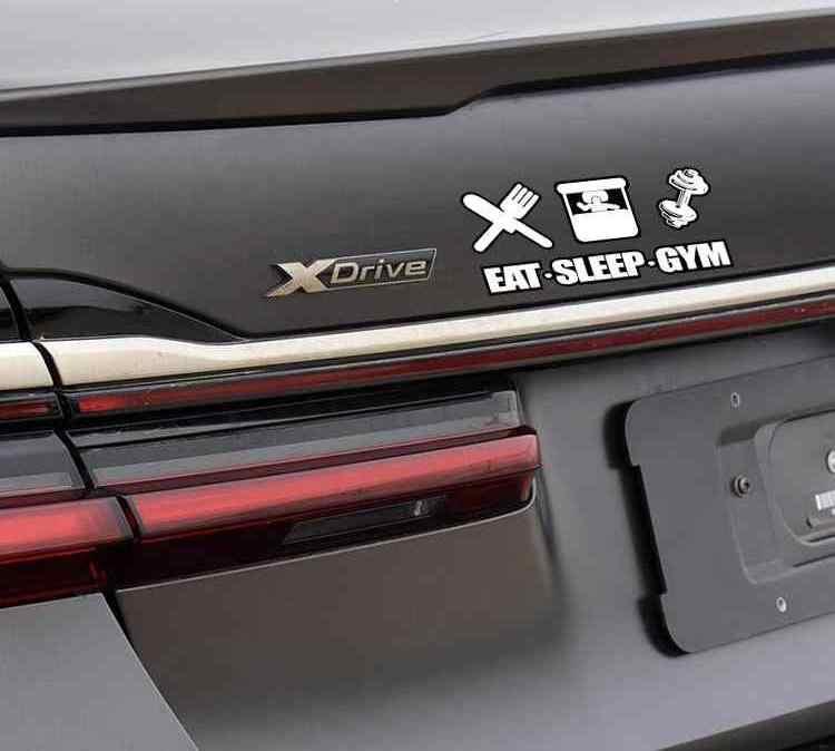Decor sticker featuring the phrase "EAT! SLEEP! GYM!" by Bean's Moto Booth, shown on a surface with vibrant, bold text design.