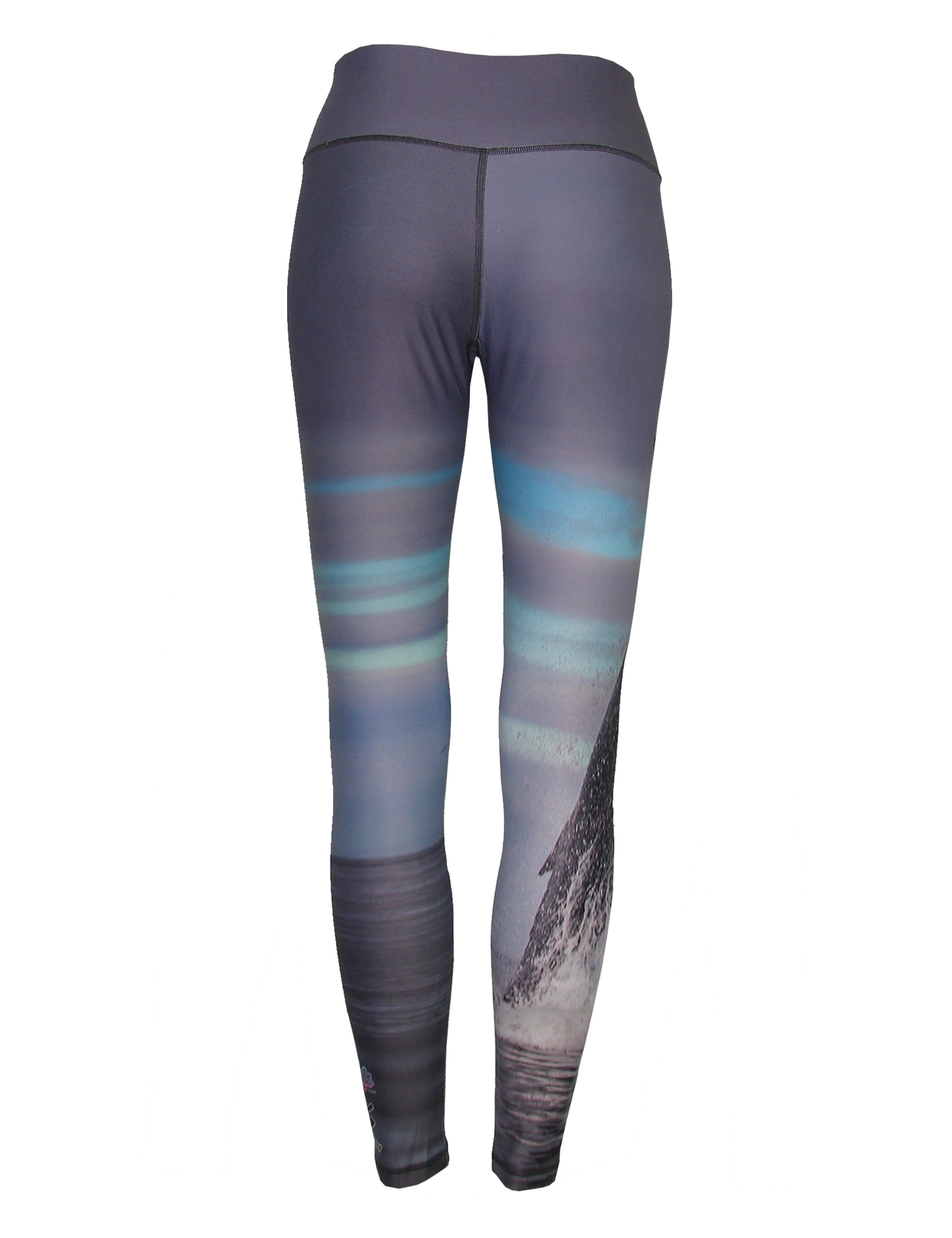 All sport leggings by Cognito Brands featuring a breech whale ocean print pattern in vibrant blue and white.