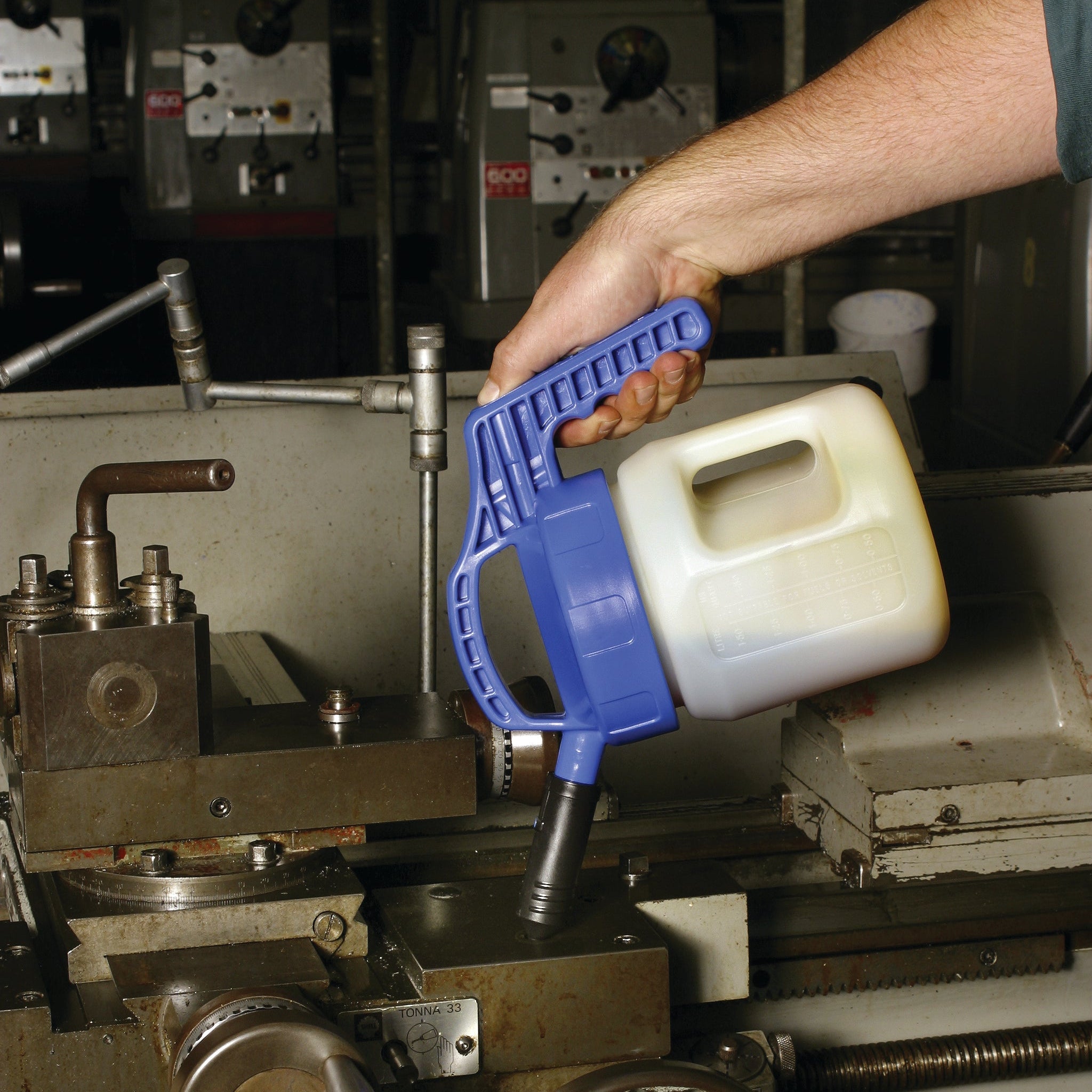 OilSafe Stumpy Spout transfer container from DRIVEN Racing Shop, high flow fluid transfer container in use.
