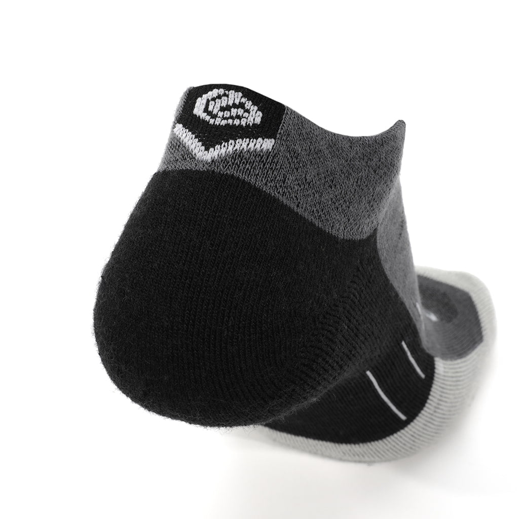 Three black GRIP6 Obsidian Edge running ankle midweight merino wool socks displayed with logo, designed for comfort and durability.