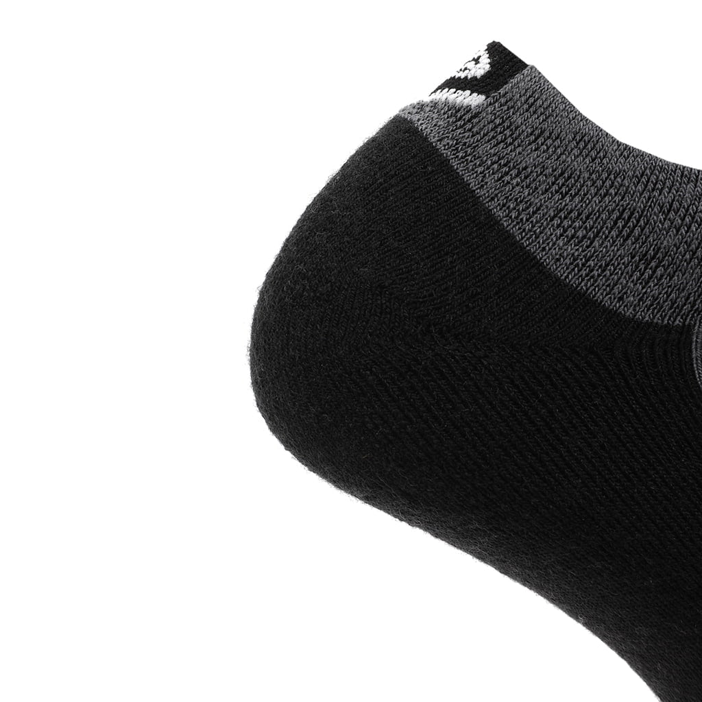 Three black GRIP6 obsidian run ankle socks made of midweight merino wool, suitable for athletic and casual wear.