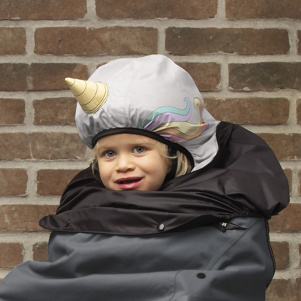 Grey Tucano Urbano thermal bike seat rain cover with hood for children, designed by ZEITBIKE, shown on a bicycle with lifestyle setting.
