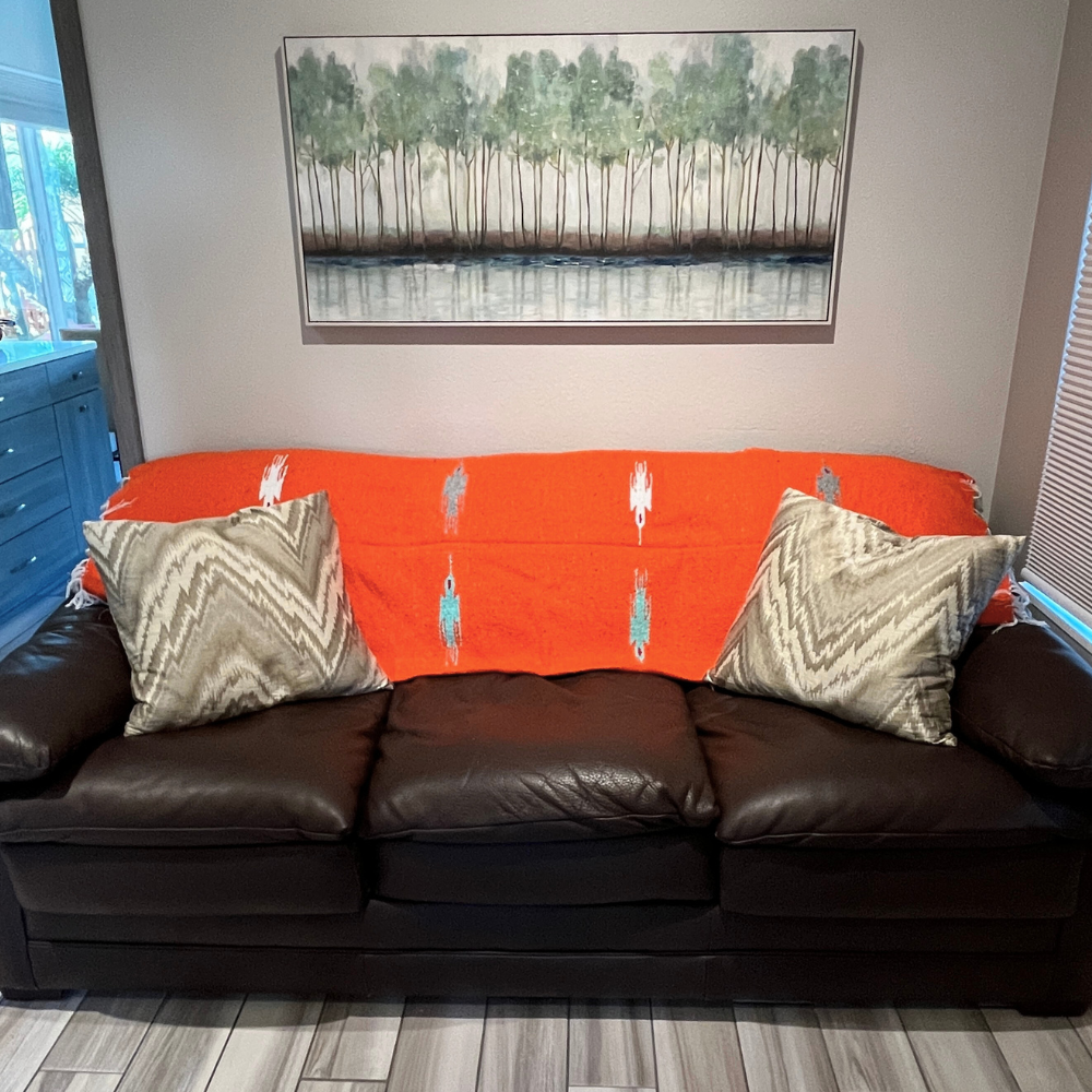 Orange Tangerine Baja Thunderbird blanket by West Path featuring a Thunderbird design on soft fabric.