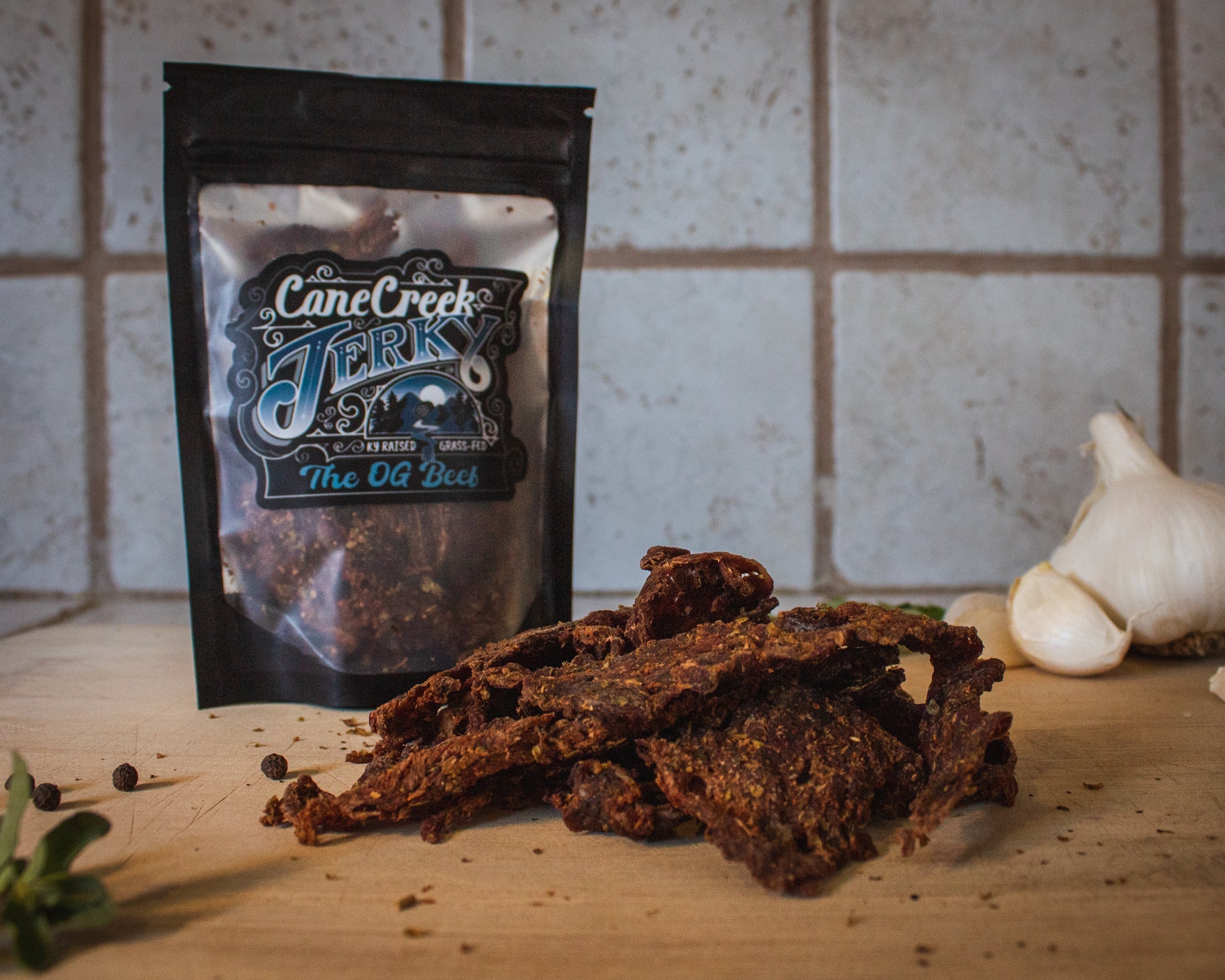 Slices of Cane Creek Jerky Bourbon & Brown Sugar Beef Jerky showing its rich, glazed exterior and tender beef texture.