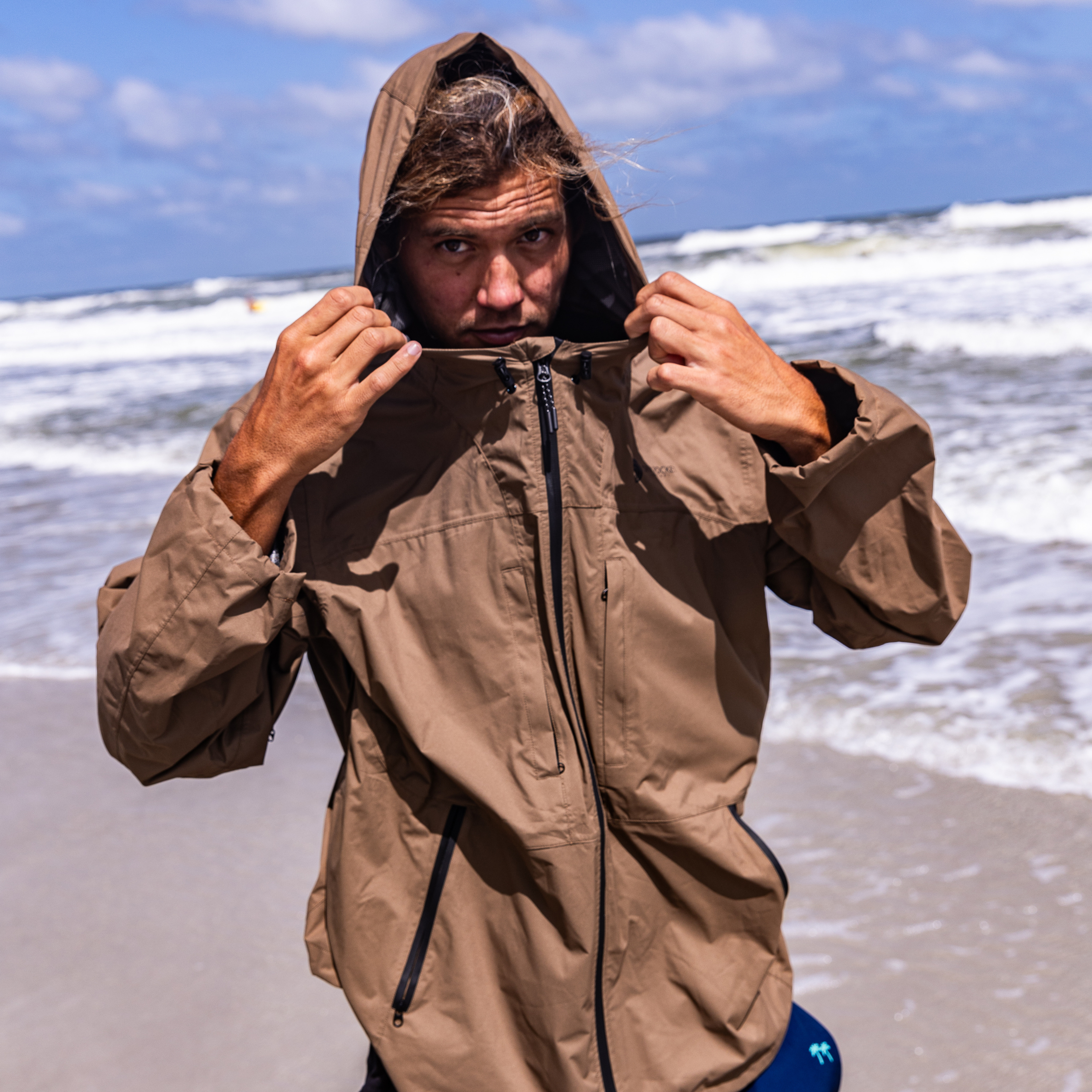 Dry Pocket Outback waterproof rain jacket with a waterproof pocket, designed for fishing and outdoor rain protection.
